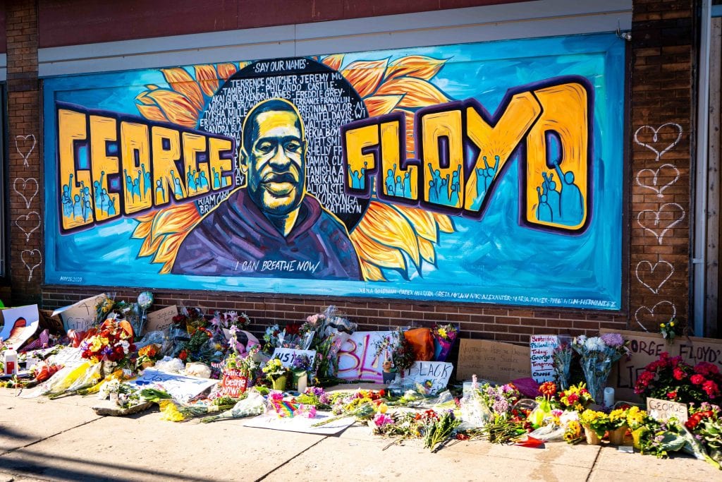 George Floyd protests power on as he is put to rest